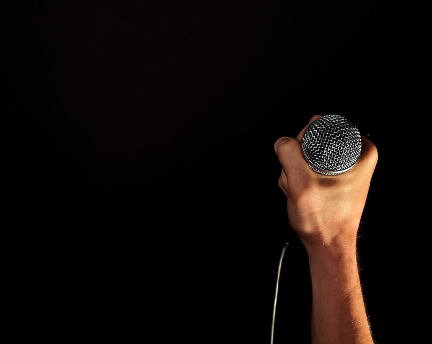 person holding microphone